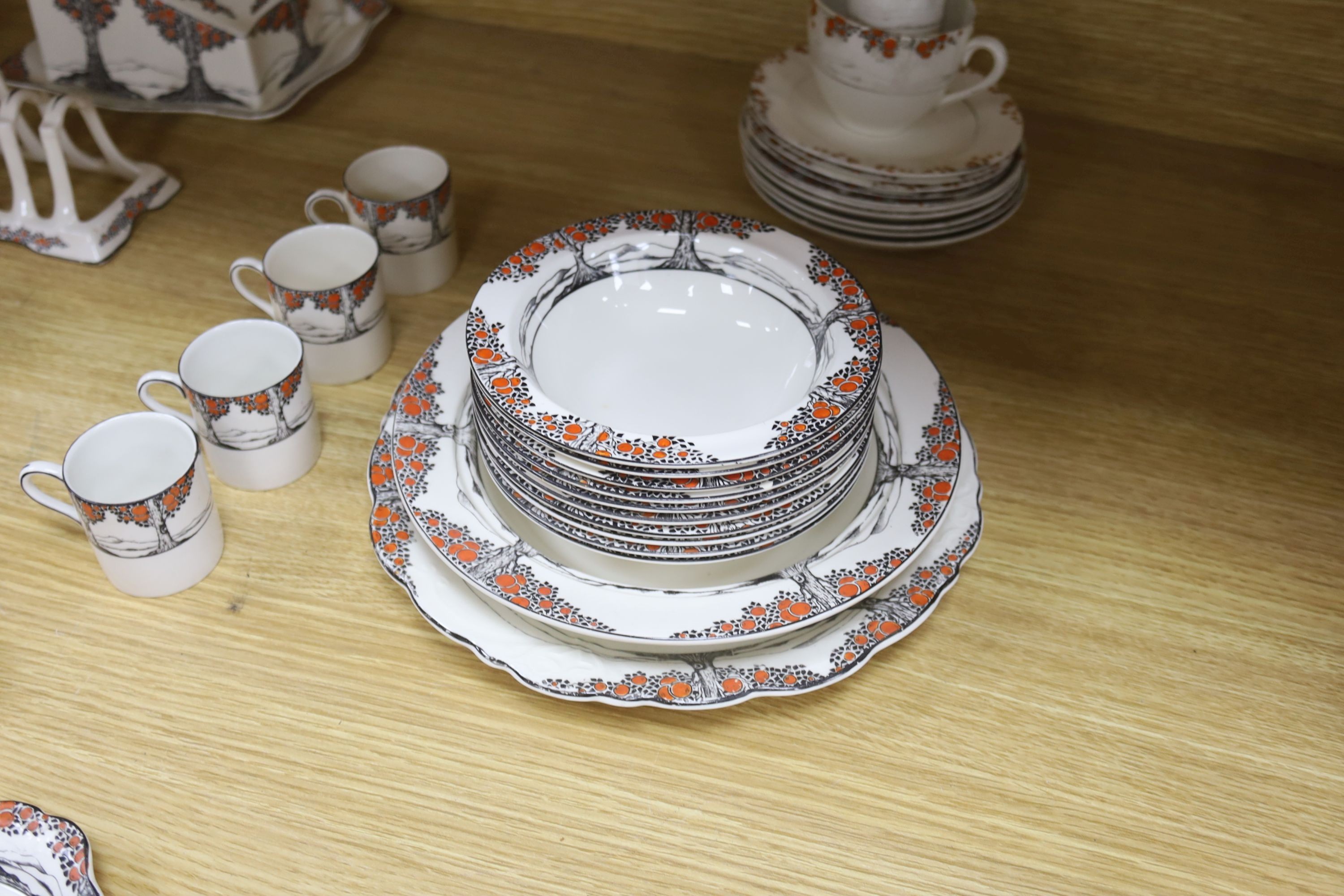 A Crown Ducal Art Deco 'Orange Tree' breakfast, tea and coffee service, to include a biscuit barrel, cheese dish and toast rack